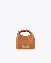 Crossbody bag with gathered strap