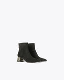 Ankle boots with golden heel