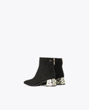 Ankle boots with golden heel