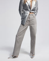 Trousers with laminated detail