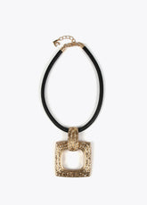 Gold-toned necklace with a black cord.