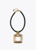 Gold-toned necklace with a black cord.