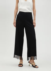 Trousers with fringing and rhinestones