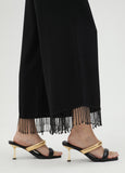 Trousers with fringing and rhinestones