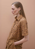 Oversized short sleeved shirt with perforated detailing