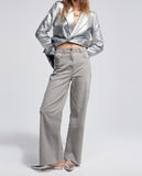 Trousers with laminated detail