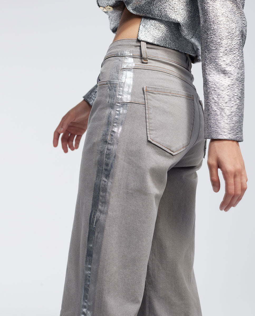 Trousers with laminated detail