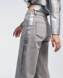 Trousers with laminated detail