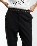 Trousers with eyelets