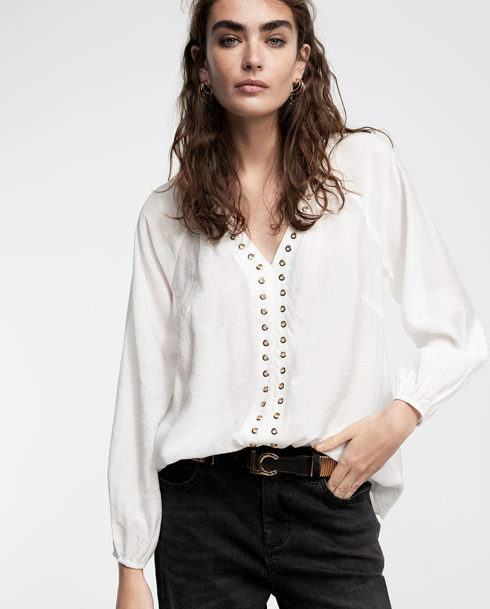 Blouse with eyelets