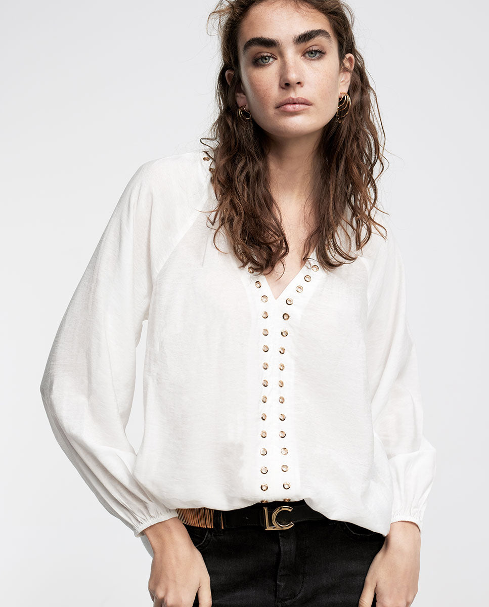 Blouse with eyelets