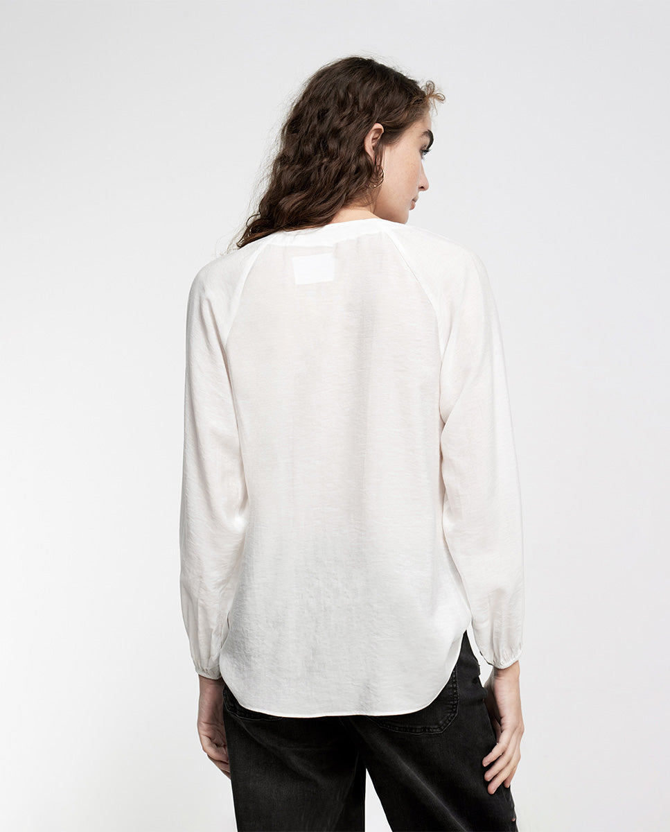 Blouse with eyelets