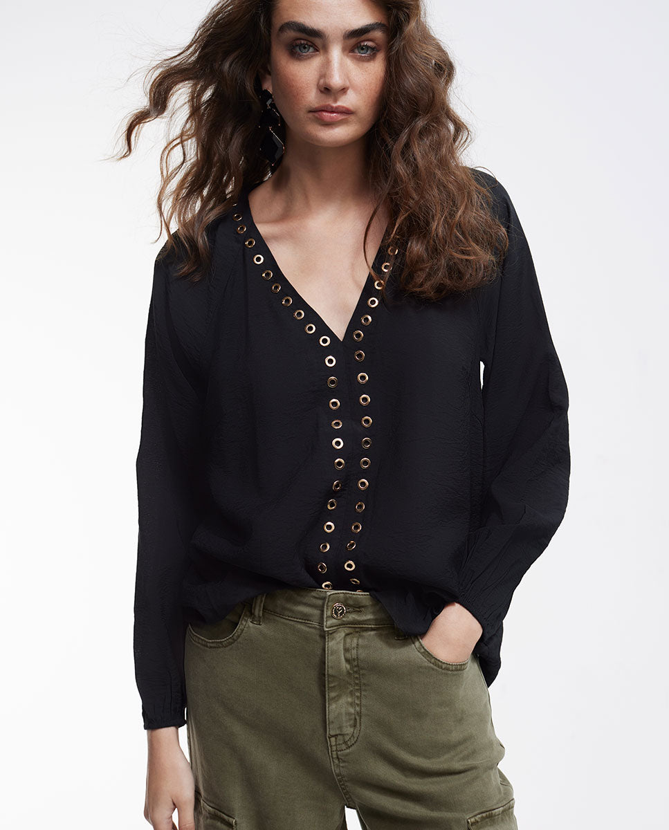 Blouse with eyelets