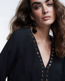 Blouse with eyelets