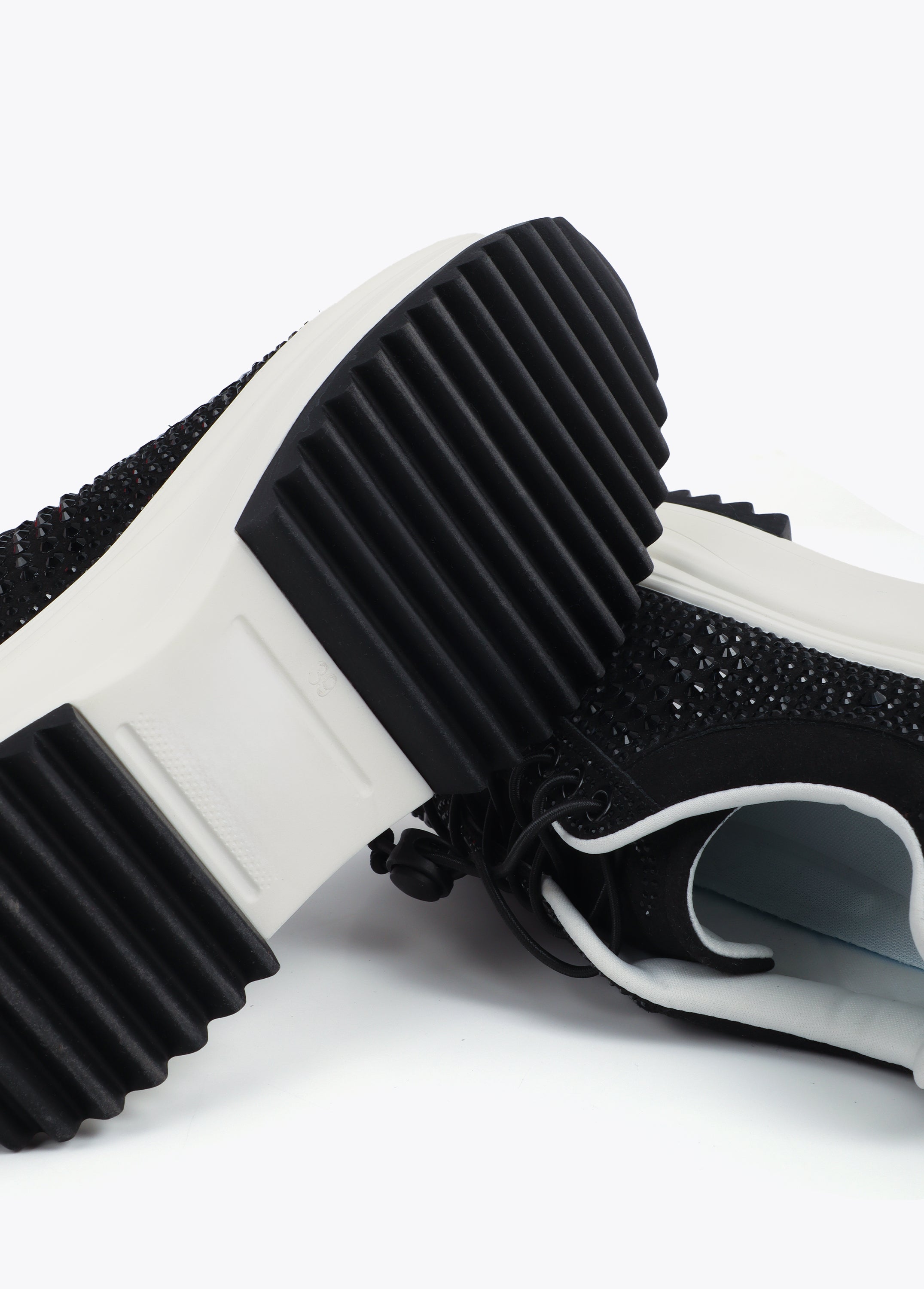 Trainers with transparent sole and rhinestone appliqués