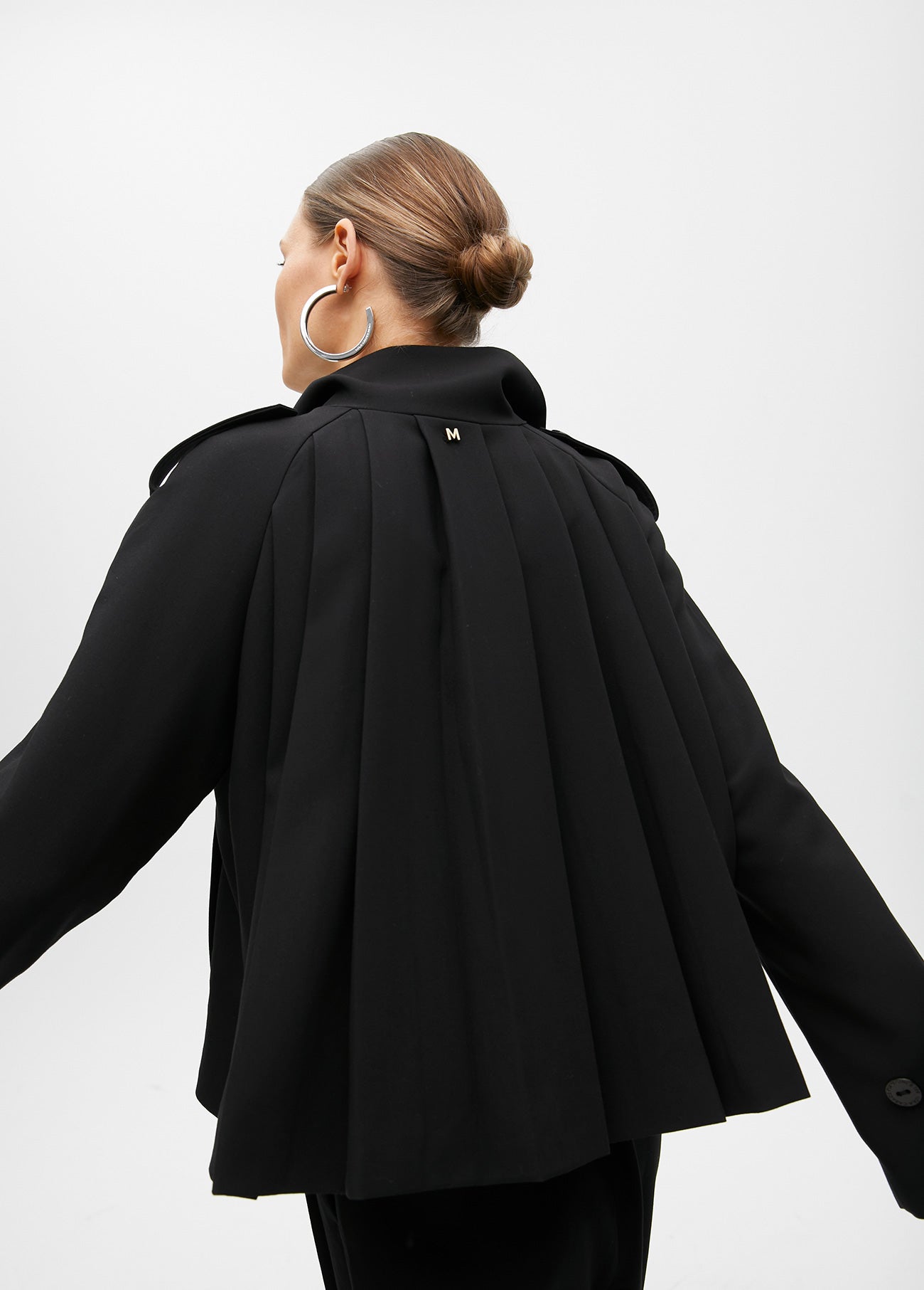 Short jacket with pleated detail on the back