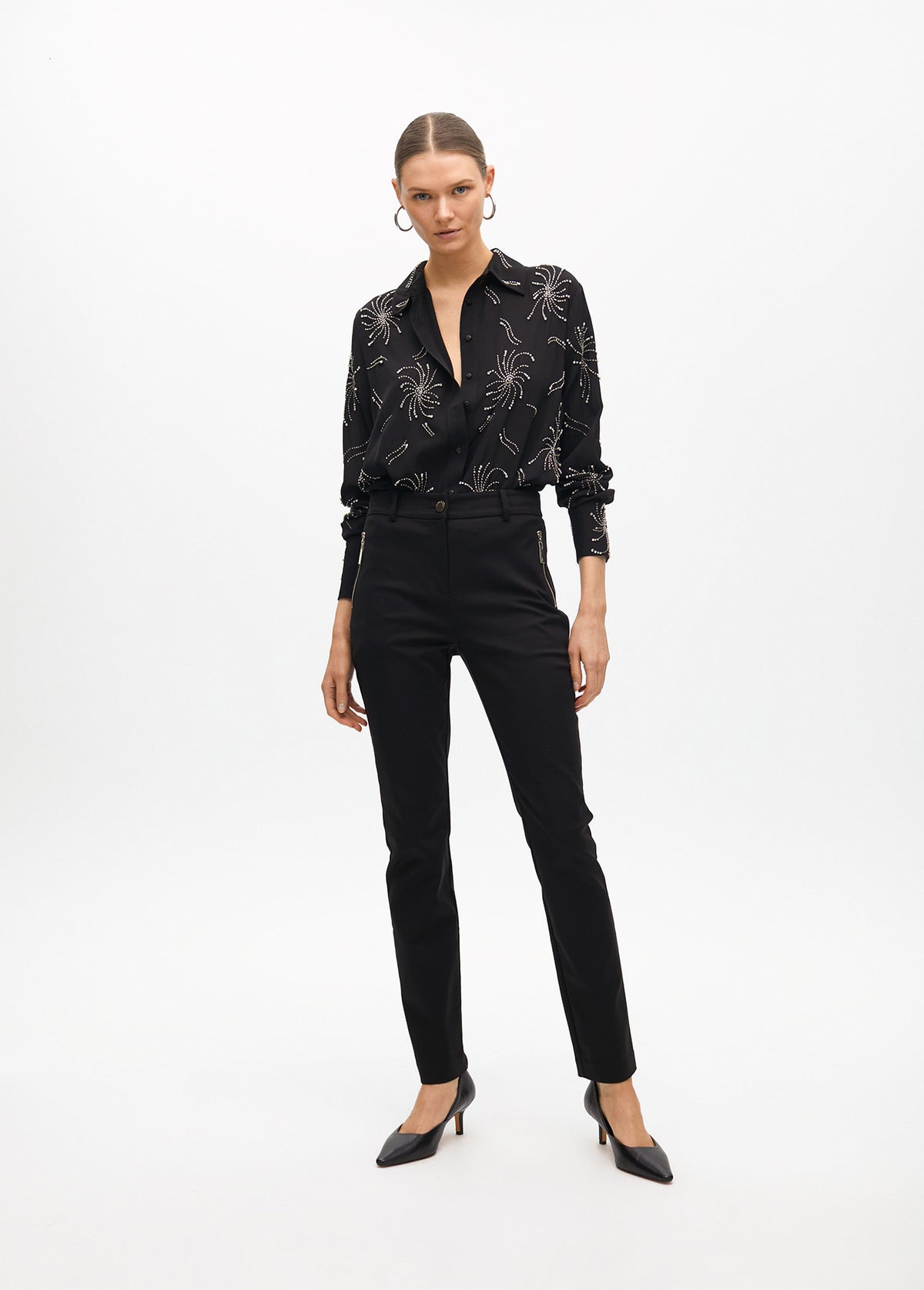 Stretch fabric trousers with zipped pocket