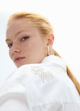 mf2615003-Oversized shirt with gold studs with positioned drawings-White