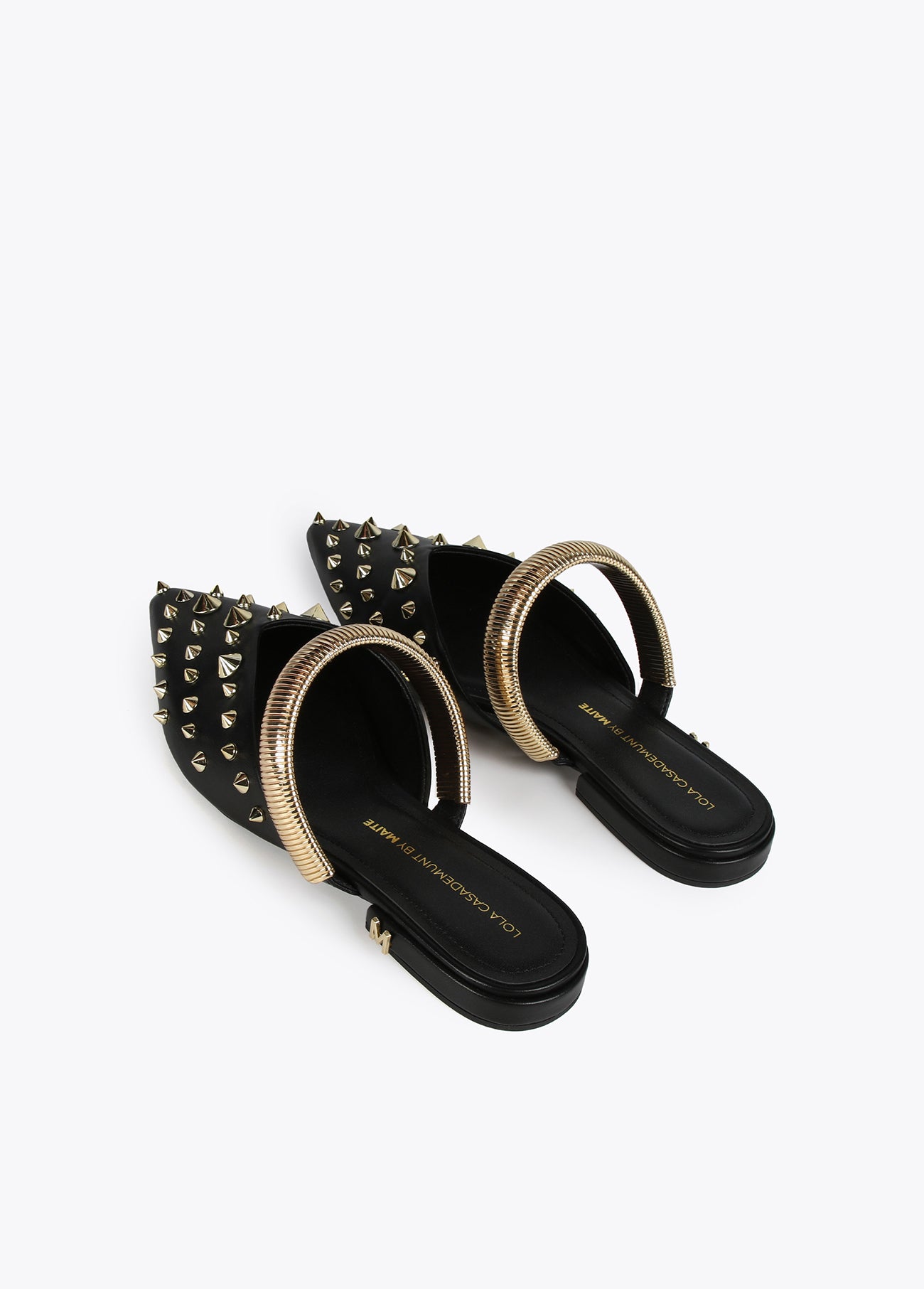 Mules with strap and metal embellishments