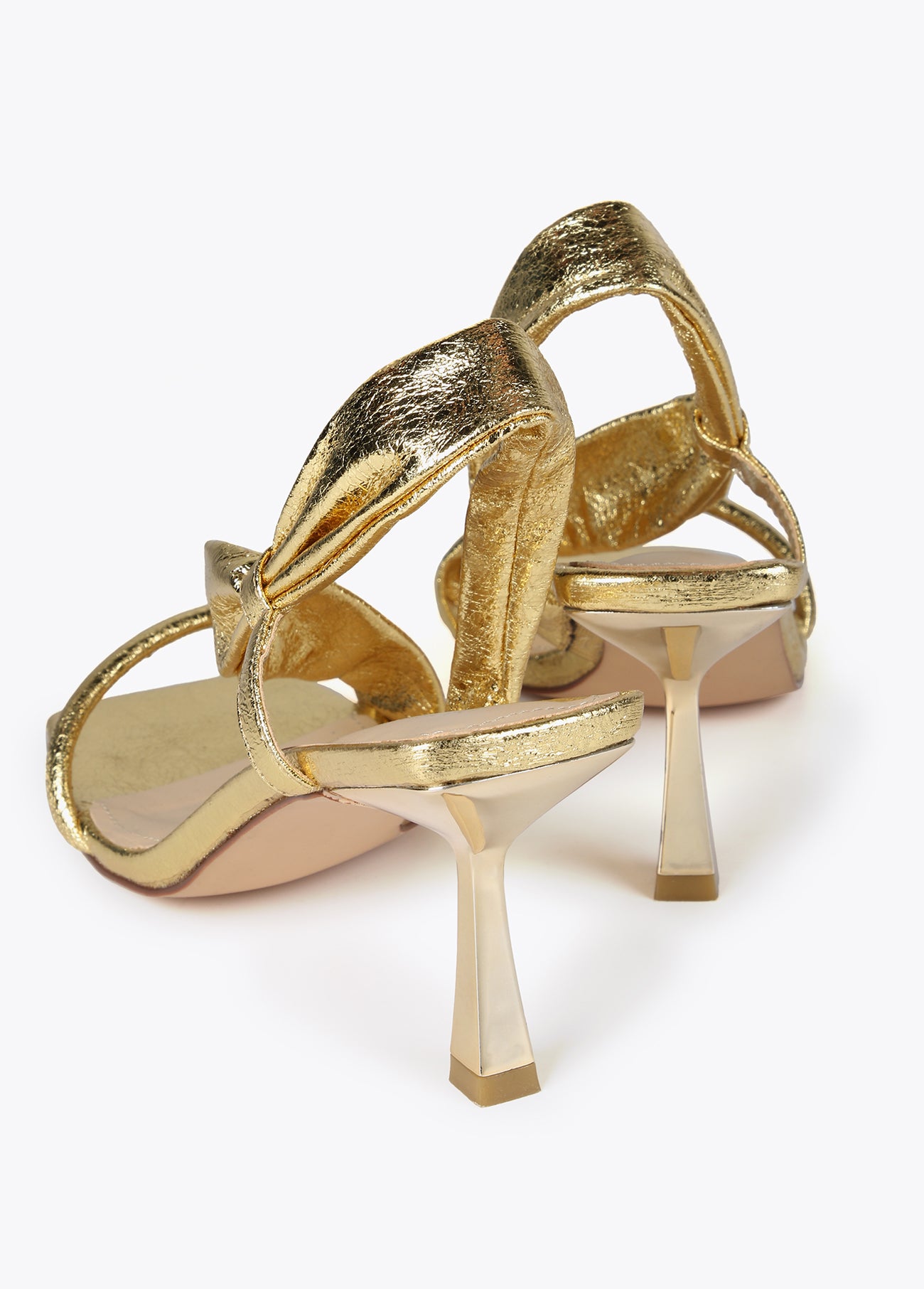 Heeled sandals with metallic straps