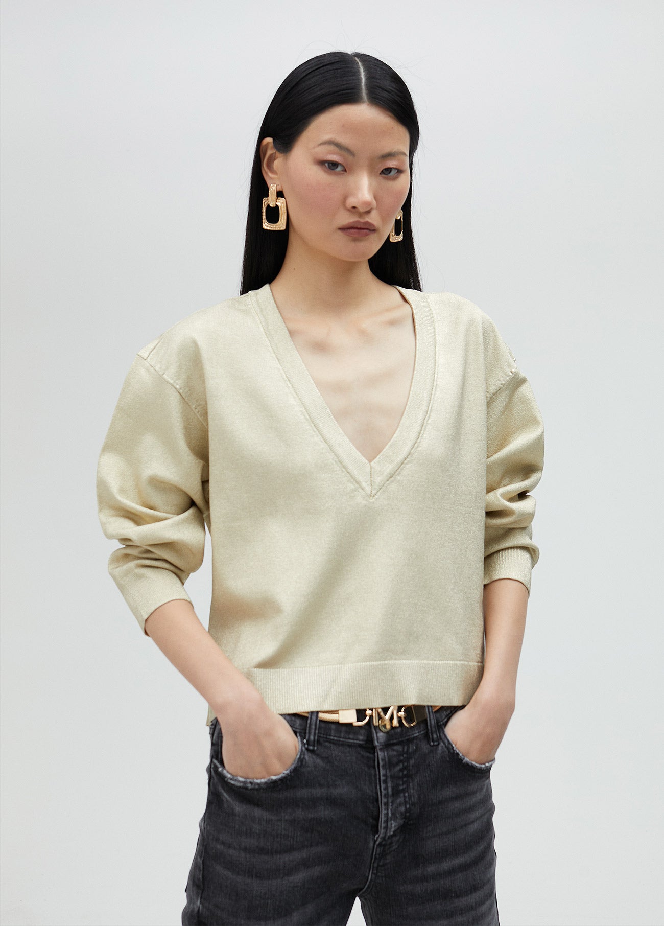 Gold V-neck sweater