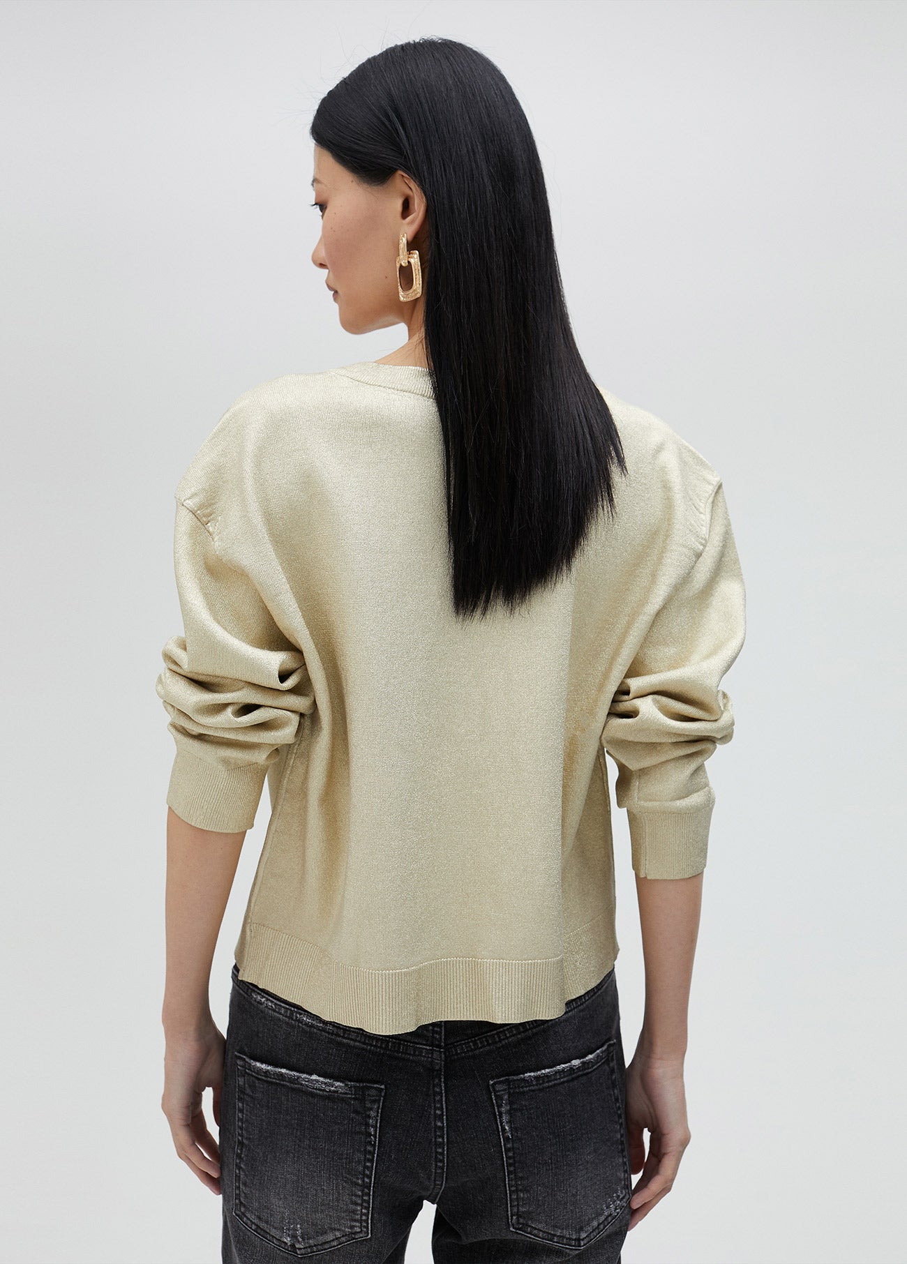 Gold V-neck sweater