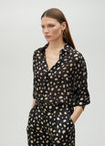 Black polka dot shirt