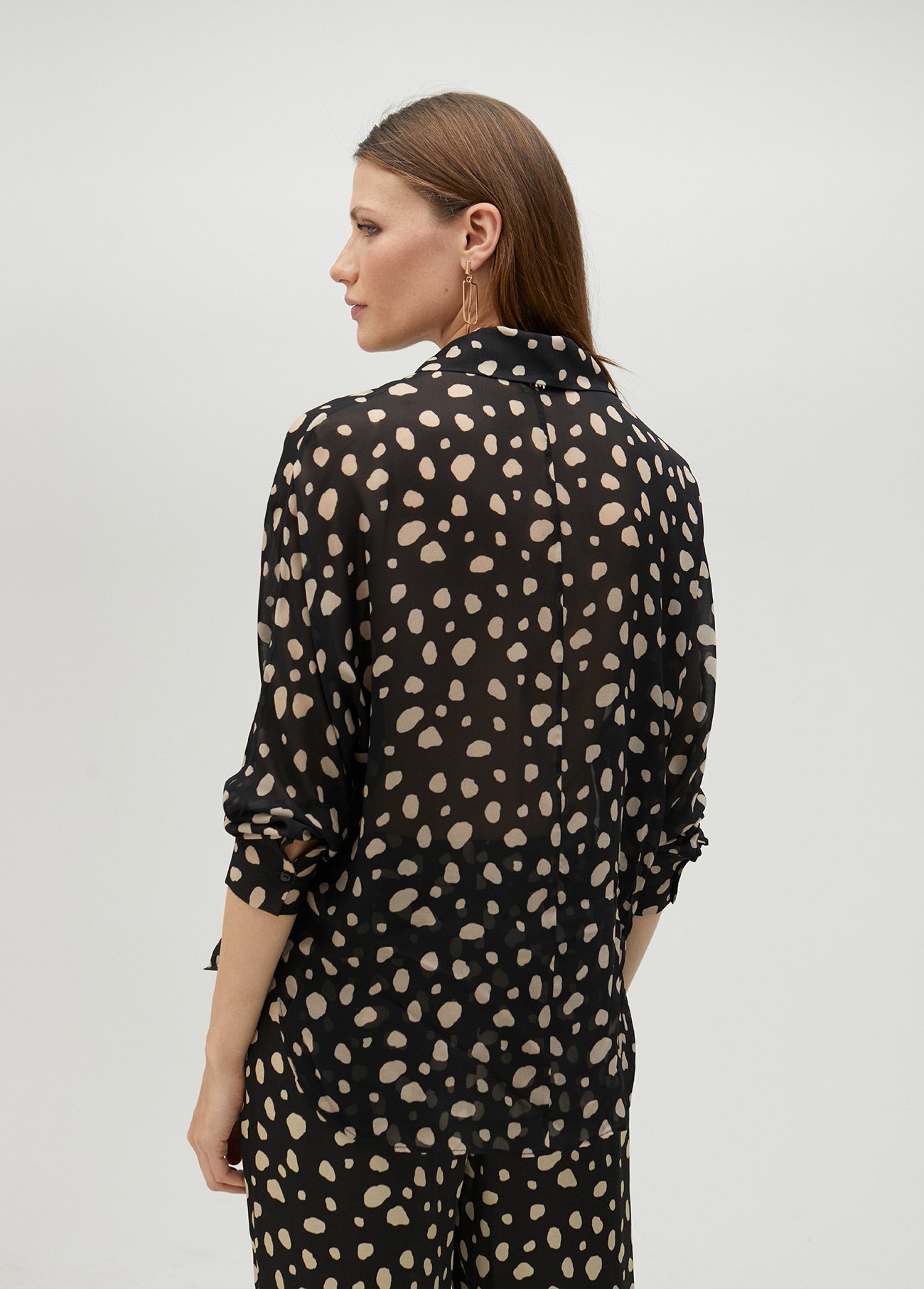 Black polka dot shirt